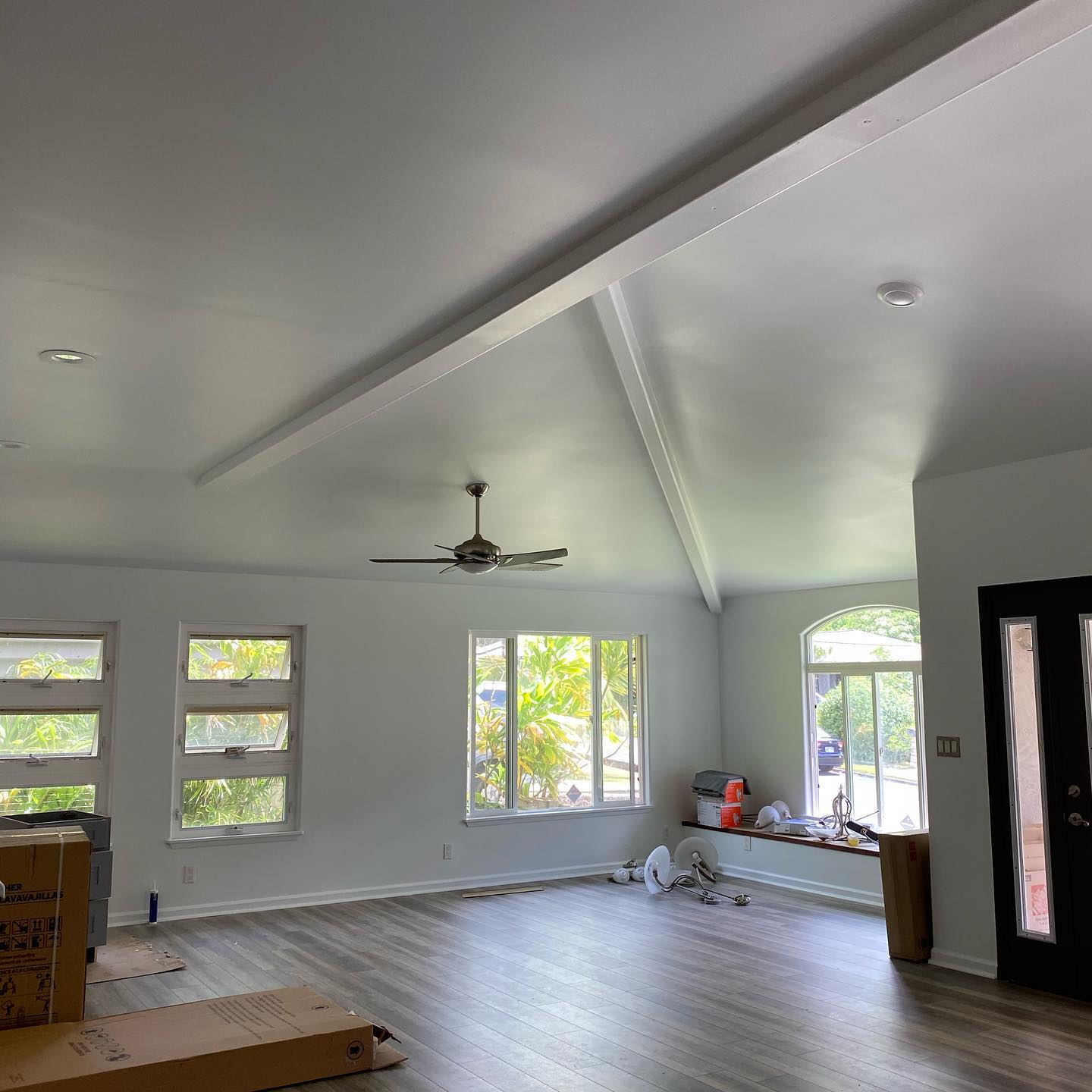 Vaulted ceiling living room interior repaint with beam detail